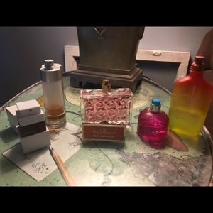 Lot of 5 designer name perfumes.